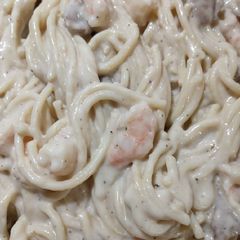 A picture of Creamy alfredo chicken and shrimp pasta.