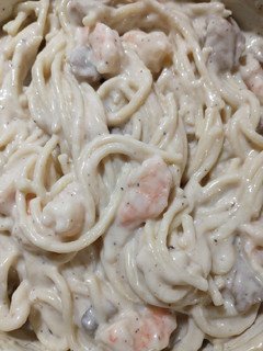 A picture of Creamy alfredo chicken and shrimp pasta.