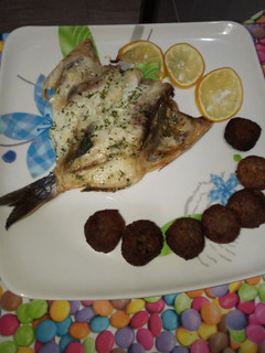 Una foto de Dorada al ajo/limon