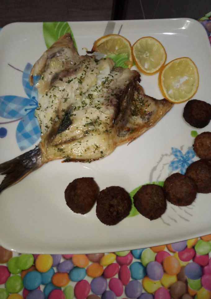Una foto de Dorada al ajo/limon