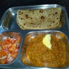 Kathiyavadi bhaji with paratha A picture of Kathiyavadi bhaji with paratha.