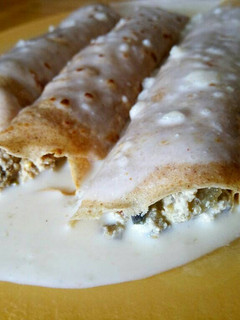 Una foto de Canelones integrales rellenos de berenjena y ricota