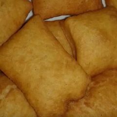 A picture of Cooking sweet mandazi.