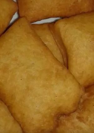 A picture of Cooking sweet mandazi.