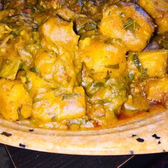 A picture of Yam porridge wit ugu leaves.