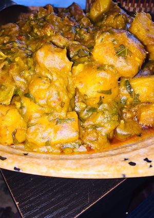 A picture of Yam porridge wit ugu leaves.