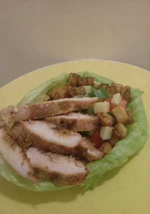A picture of Honey, ginger chicken and Kiwi infused salad lettuce bowl.