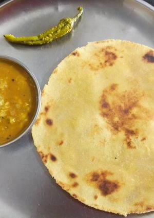 A picture of Dal fry and makki roti.