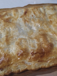 Una foto de Empanada de bacon, dátiles y queso azul