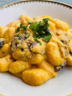 A picture of Gnocchi with Pumpkin Cream and Mushrooms.