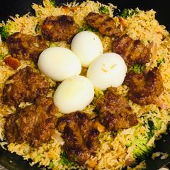 A picture of Veg rice with eggs and keema bora.