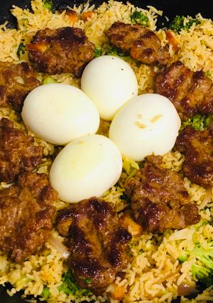 A picture of Veg rice with eggs and keema bora.