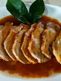 Una foto de Lomo ibérico a "las mandarinas"