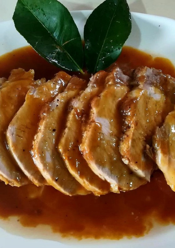 Una foto de Lomo ibérico a "las mandarinas"