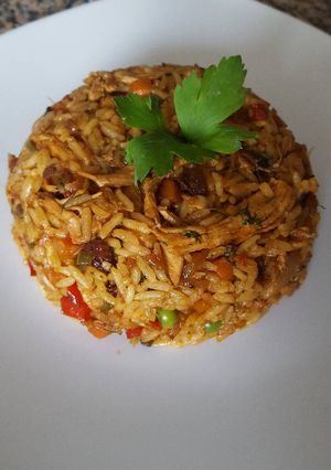 Una foto de Arroz con pollo meloso