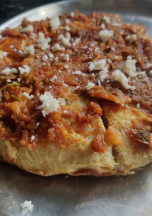 A picture of Egg pav bhaji pizza dosa.