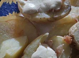 Una foto de Papas Rellenas de Tocino y Queso Oaxaca