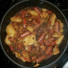 A picture of Minced meat served in sausages and potatoes.