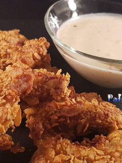 Una foto de Pollo rebozado crujiente en freidora de aire, sin nada de aceite