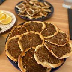 A picture of Lebanese homemade meat pies/ Lahm bi Ajeen or Sfiha.