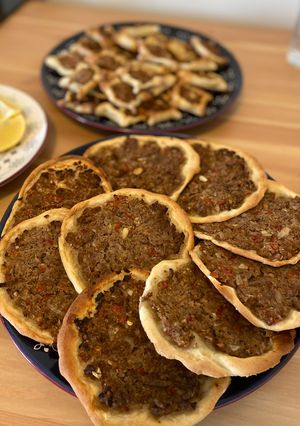 A picture of Lebanese homemade meat pies/ Lahm bi Ajeen or Sfiha.