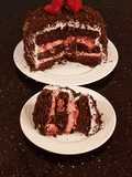 Chocolate Layer Cake with Strawberry Cream Filling, White Chocolate Ganache Frosting coated with a Chocolate Crumble