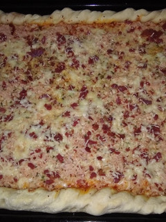 Una foto de Pizza casera jamón