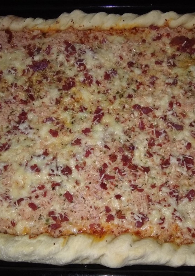 Una foto de Pizza casera jamón