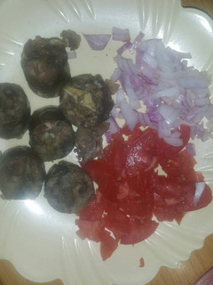 A picture of African sausage(mutura) served with salad.