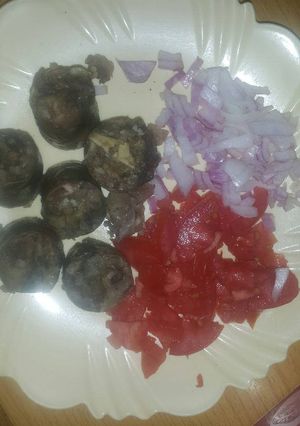 A picture of African sausage(mutura) served with salad.