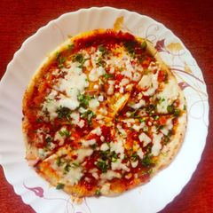 Cheesy Onion Aloo Uttapam A picture of Cheesy Onion Aloo Uttapam.