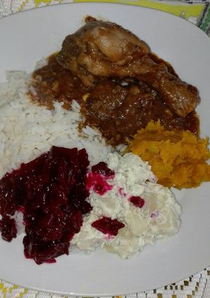 A picture of Chicken stew and salads.
