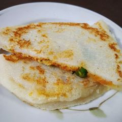A picture of Stuffed rawa utappam.