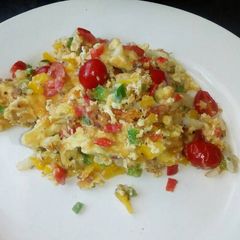 A picture of Messy scrambled eggs.