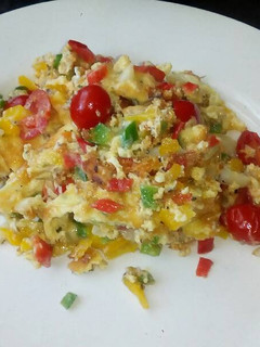 A picture of Messy scrambled eggs.