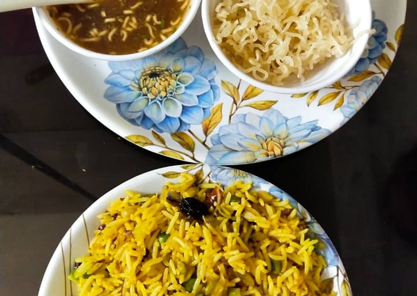 Veg biryani mounchrian soup and salad with fried Maggi