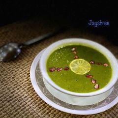 A picture of Drumstick and spinach soup.