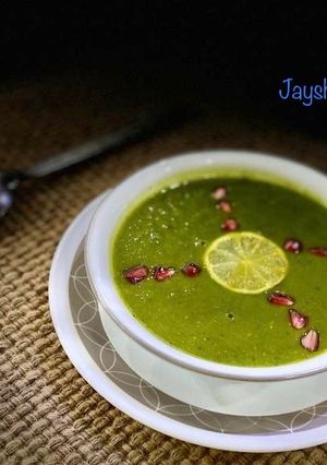 A picture of Drumstick and spinach soup.