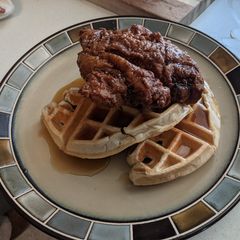 A picture of Eric's Chicken and Waffles with Maple Bourbon Syrup.