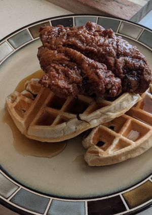 A picture of Eric's Chicken and Waffles with Maple Bourbon Syrup.