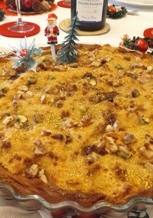 Una foto de Puding de pandoro con chocolate y mermelada de melocotón al champagne