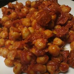 A picture of Chickpea and chorizo tapas.