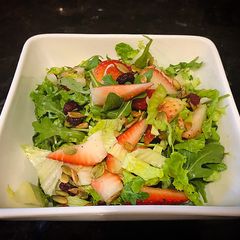Freshly Lettuce Arugula Strawberry Salad A picture of Freshly Lettuce Arugula Strawberry Salad.