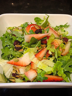 A picture of Freshly Lettuce Arugula Strawberry Salad.