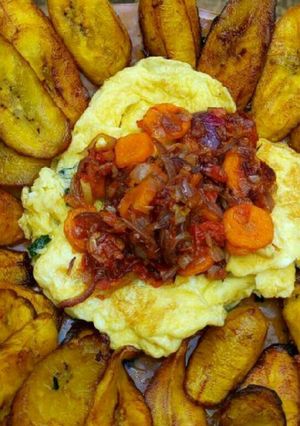 A picture of Fried plantain,scrambled eggs and carrot sauce.