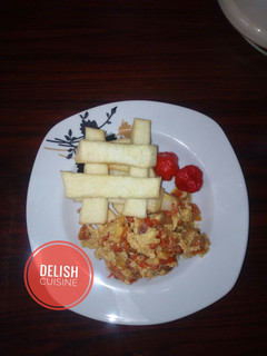 A picture of Fried yam strips with egg sauce.