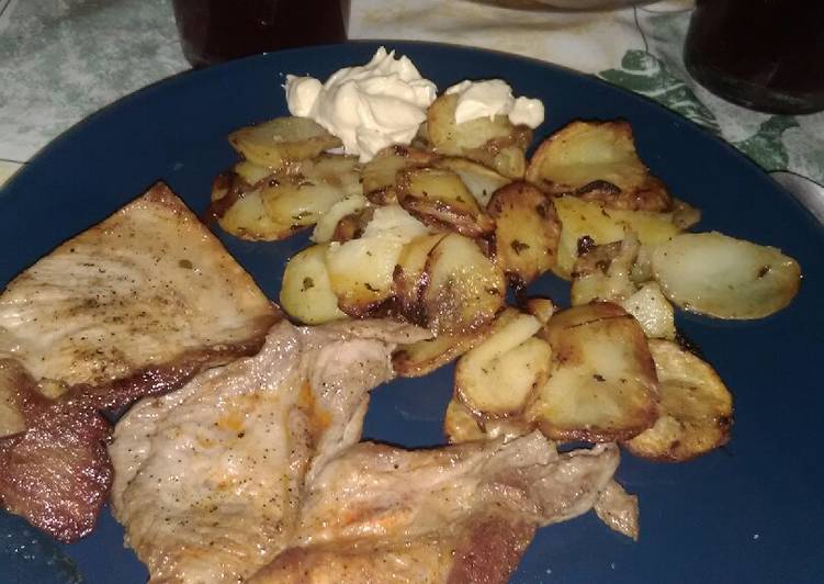 Secreto a la plancha con papas a la panadera