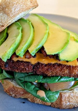 A picture of Schnitzel Sandwich with Crispy Bacon.