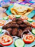 Beef gola kabab with puri paratha,salad chutney