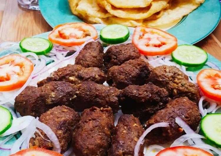 Beef gola kabab with puri paratha,salad chutney